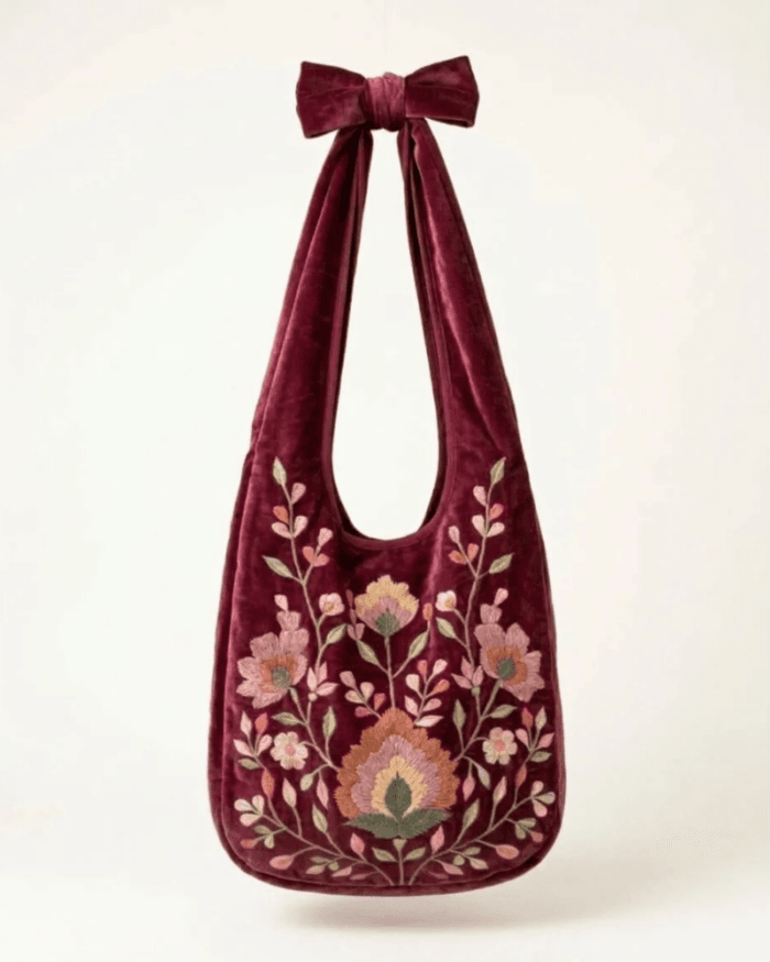 Burgundy embroidered velvet bag, front view on plain background with Rodia bloom embroidery